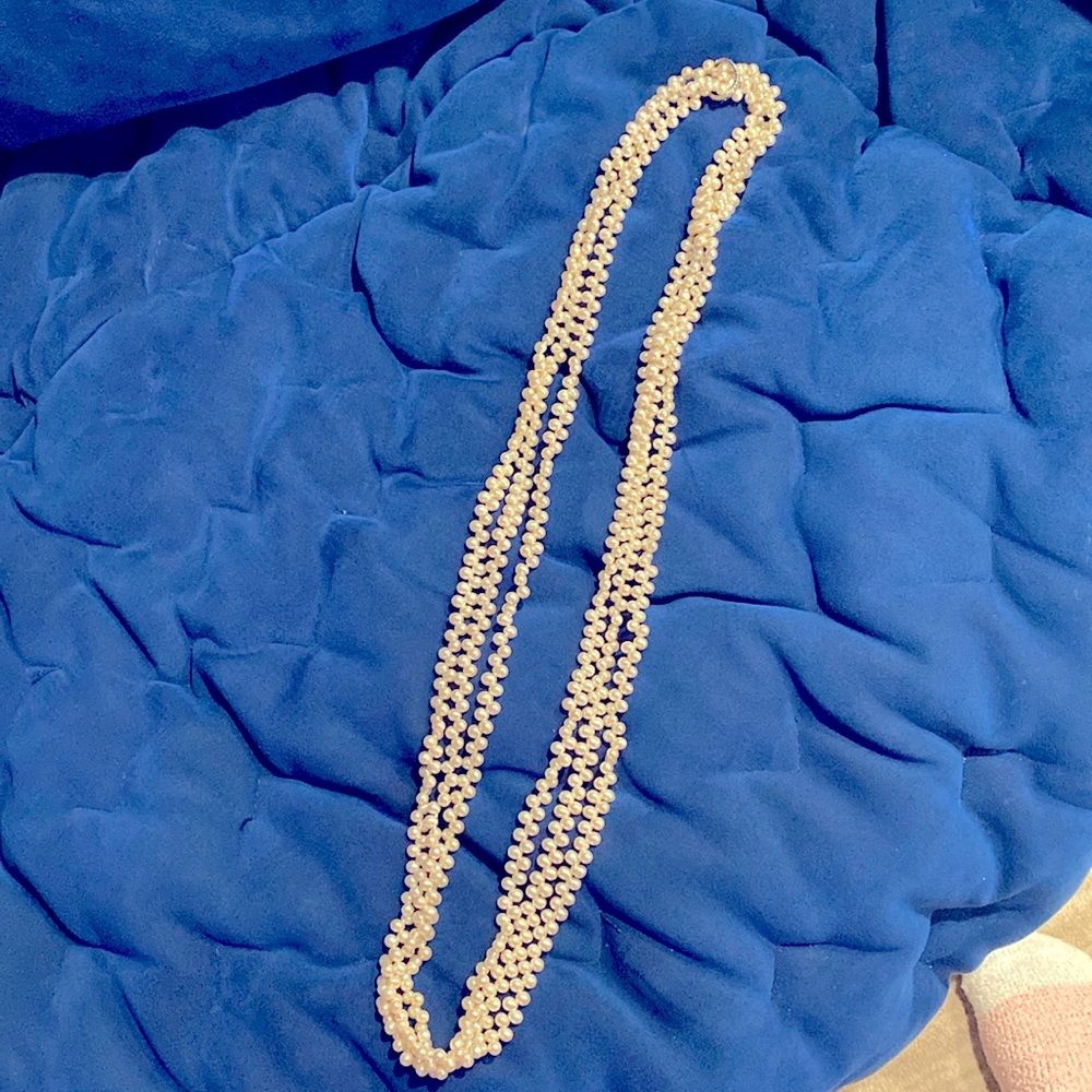 Three long set of pearls.